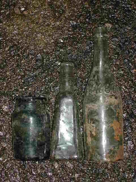 Three nice food containers, including a lovely green jam jar